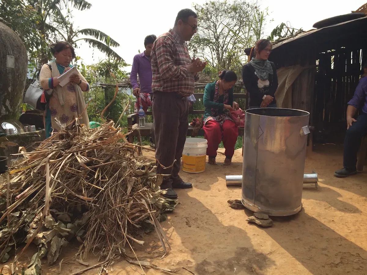 Dry plant material beside the demonstration drum